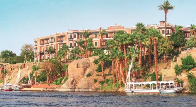 View from the water of Egypt's famous Old Cataract Hotel on an In-Style small group tour